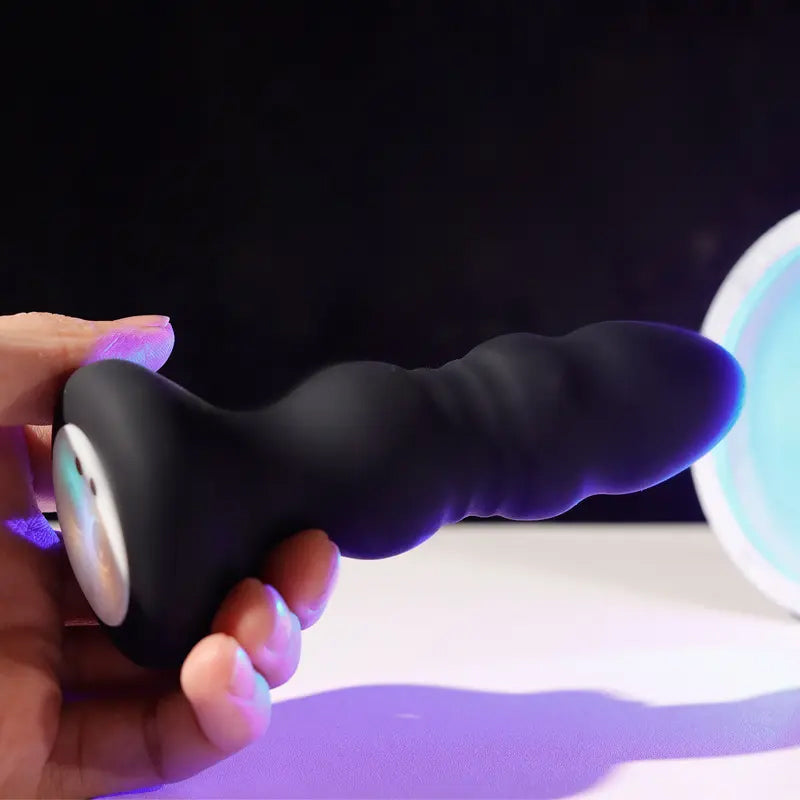 Plug Anal Vibrador con Empuje + Control Remoto y Luces LED (2 en 1)